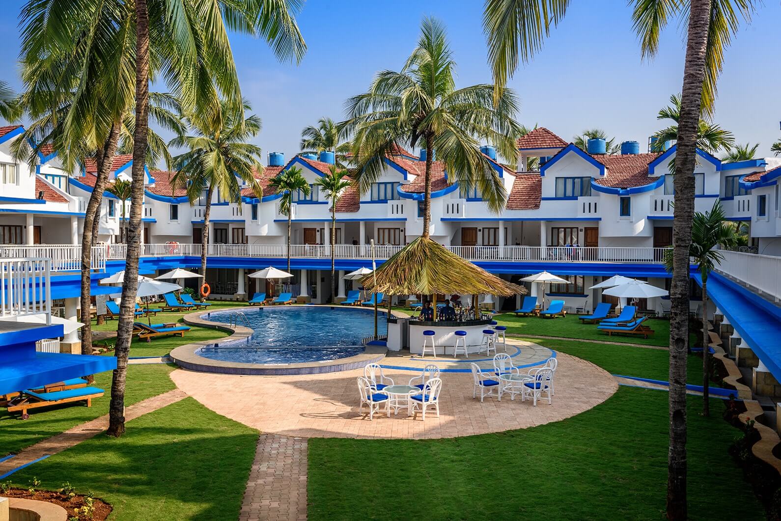 pool bar and green yard of luxury hotel of Karma Royal Benaulim