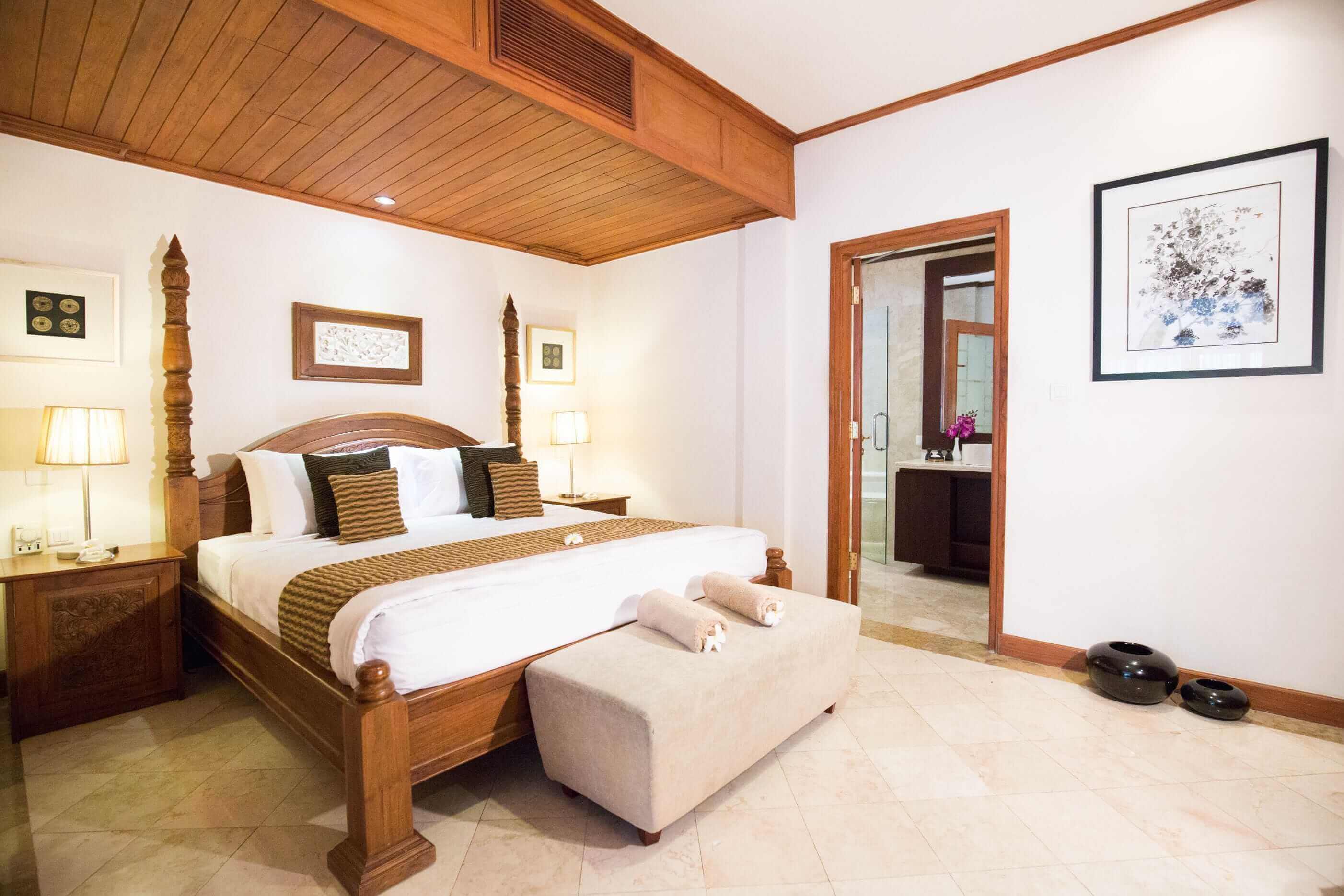 white and wood interior bedroom of luxury hotel Karma Royal Jimbaran Accommodation