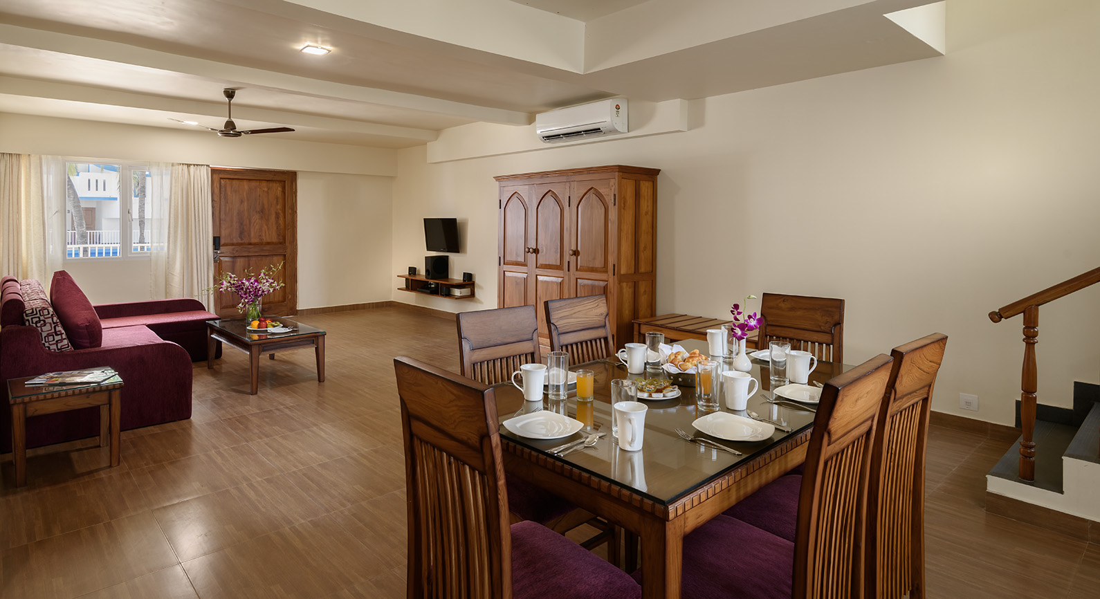 elegant and classy wood interior of luxury hotel Karma Royal Benaulim Rooms livingroom