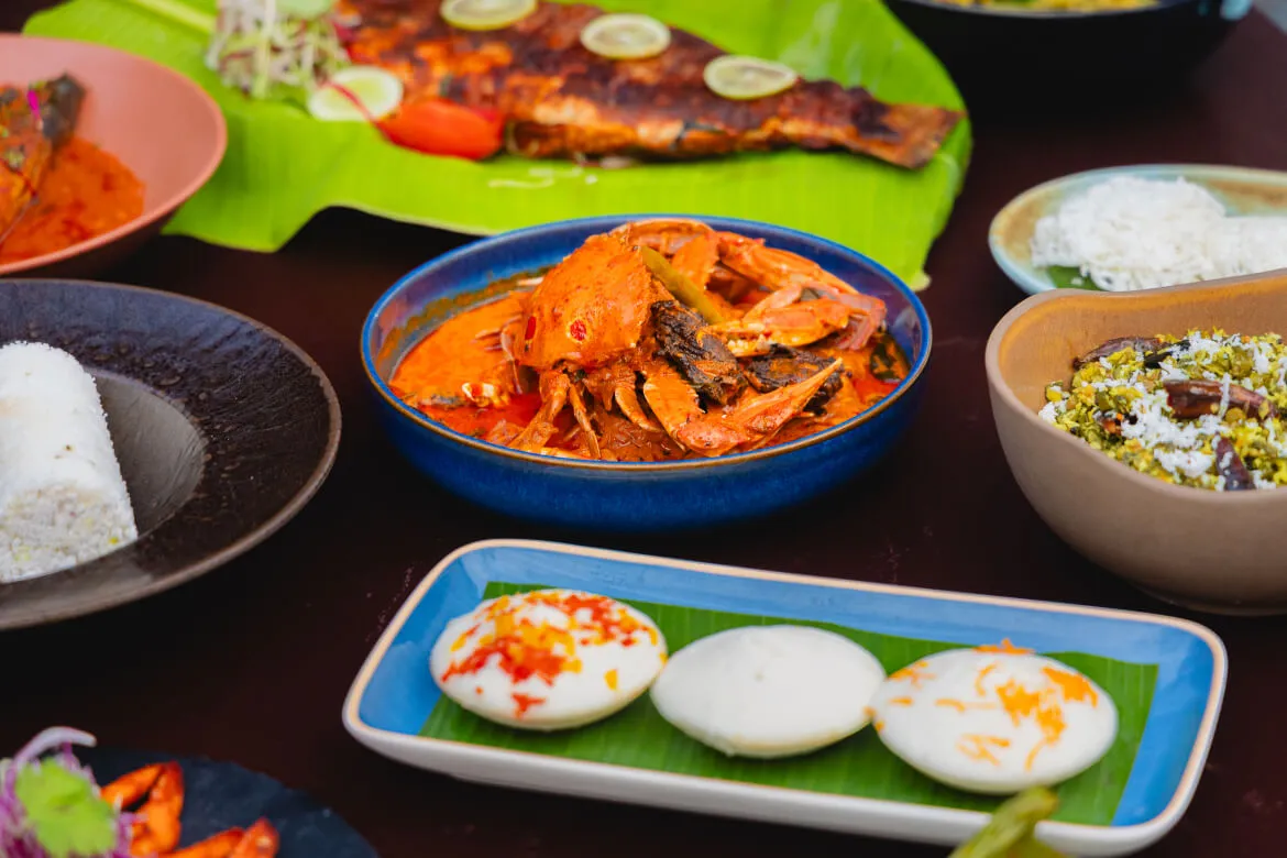 South Indian seafood spread with crab curry and grilled fish at Karma Vythiri restaurant
