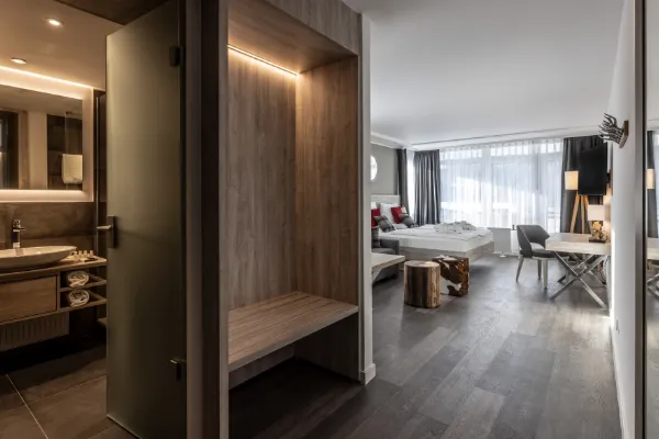 En-suite bathroom with rainfall shower at Karma Bavaria, a luxury resort in Schliersee