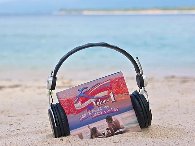 Karma Music Collection album with headphones on the beach