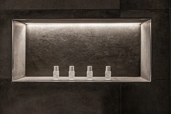 En-suite bathroom with rainfall shower at Karma Bavaria, a luxury resort in Schliersee