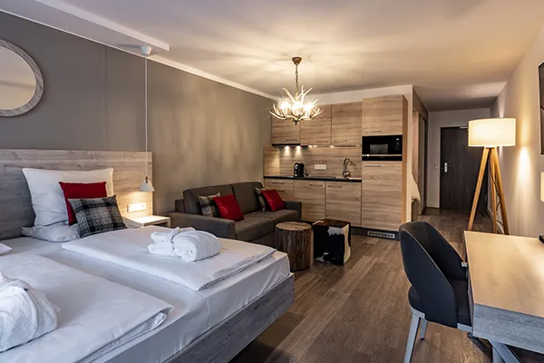 En-suite bathroom with rainfall shower at Karma Bavaria, a luxury resort in Schliersee