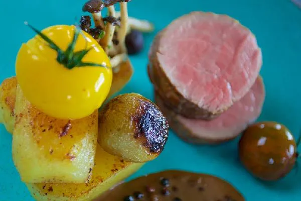 Pink-roasted loin with fondant potatoes, mushrooms and peppercorn sauce at Cloudesley Shovell Restaurant