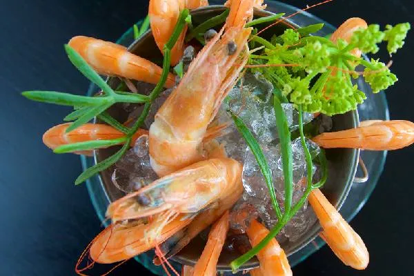 Chilled whole prawns on crushed ice with fresh herbs at Cloudesley Shovell Restaurant, Karma St. Martin's