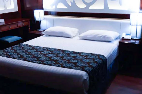 Cabin Double with backlit Egyptian-motif headboard at Karma Karnak