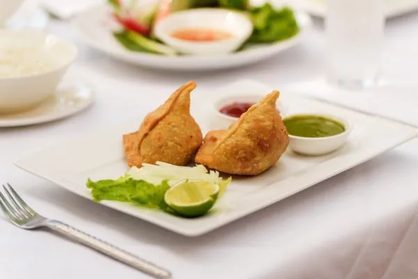 Fried samosas with tamarind and mint chutney at Karma Bayon Restaurant & Bar