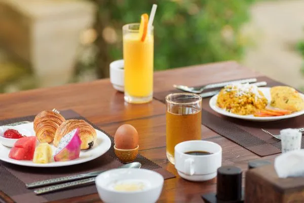 Breakfast spread with croissants, fresh fruit and coffee at Karma Bayon Restaurant & Bar