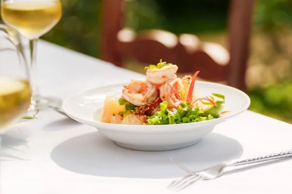 Shrimp and citrus salad with white wine at Karma Bayon Restaurant & Bar